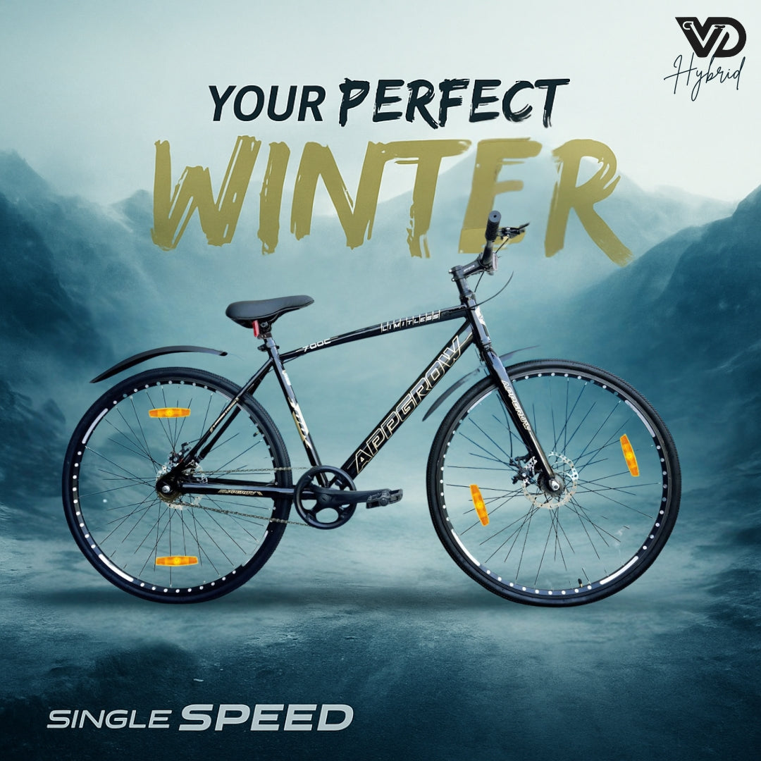 Appgrow 700C Limitless hybrid cycle in black with dual disc brakes and single speed, shown in a snowy mountain landscape with 'Your Perfect Winter' and 'Single Speed' branding.