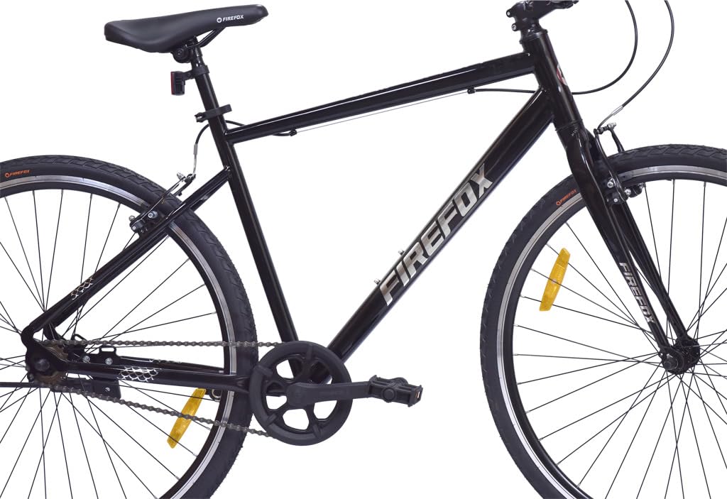 “Side profile of the black FIREFOX Whiplash 700C T Hybrid Cycle with single-speed drivetrain and yellow wheel reflectors, shown on a white background”