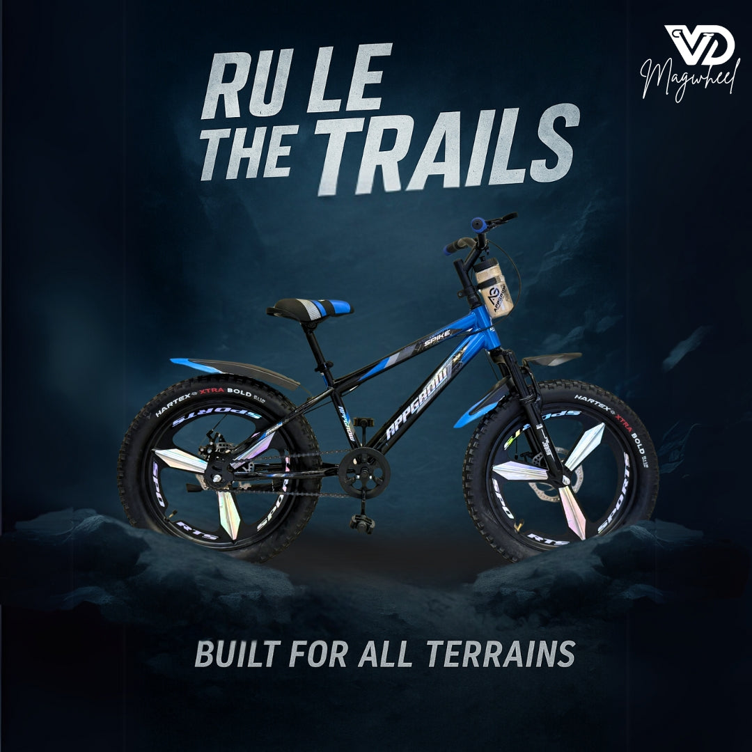 Appgrow 20T Spike blue fatbike with magwheels, designed for all terrains, shown against a rugged mountain background with the text ‘RULE THE TRAILS’ and ‘BUILT FOR ALL TERRAINS’.

