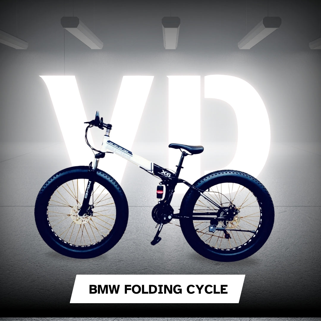 "Black and white BMW 26T folding fat tyre cycle with X6 suspension frame and dual disc brakes, placed in a lit studio with VD branding in the background"

