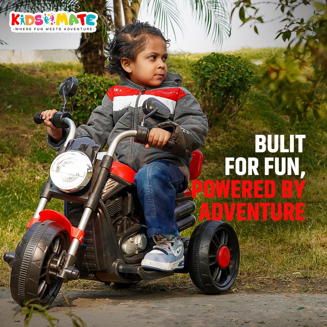 Toddler on a battery-operated bike from Kids Mate brand with greenery background