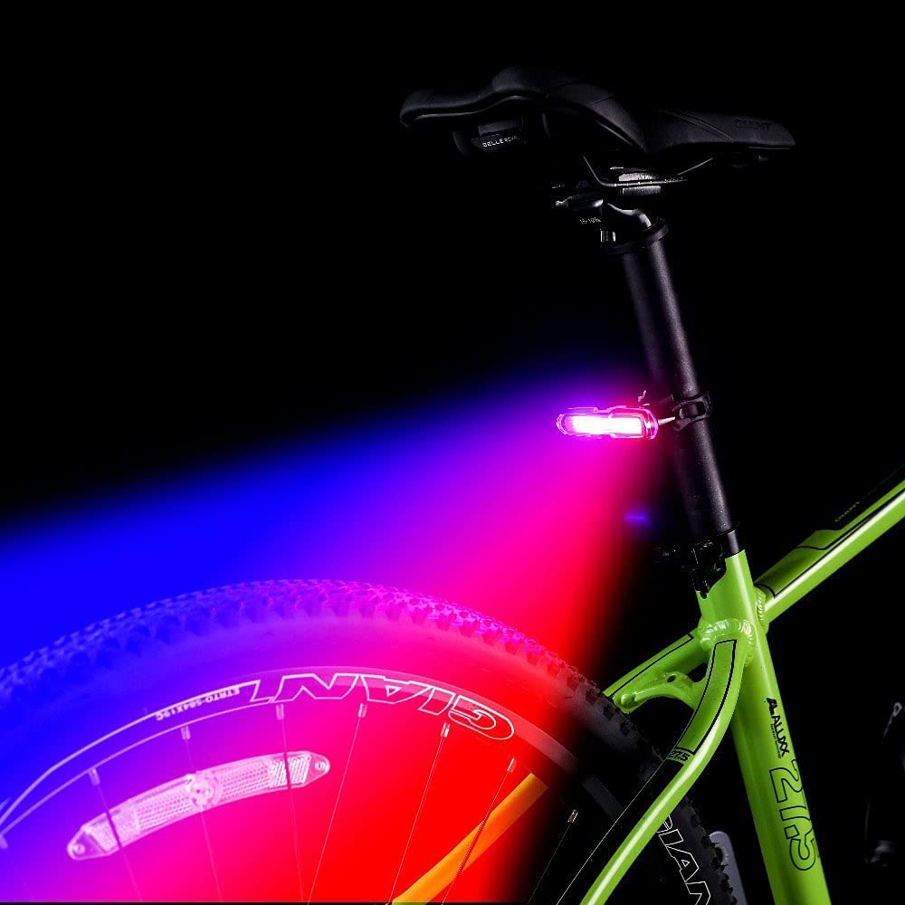 Bicycle with a red light on a black background