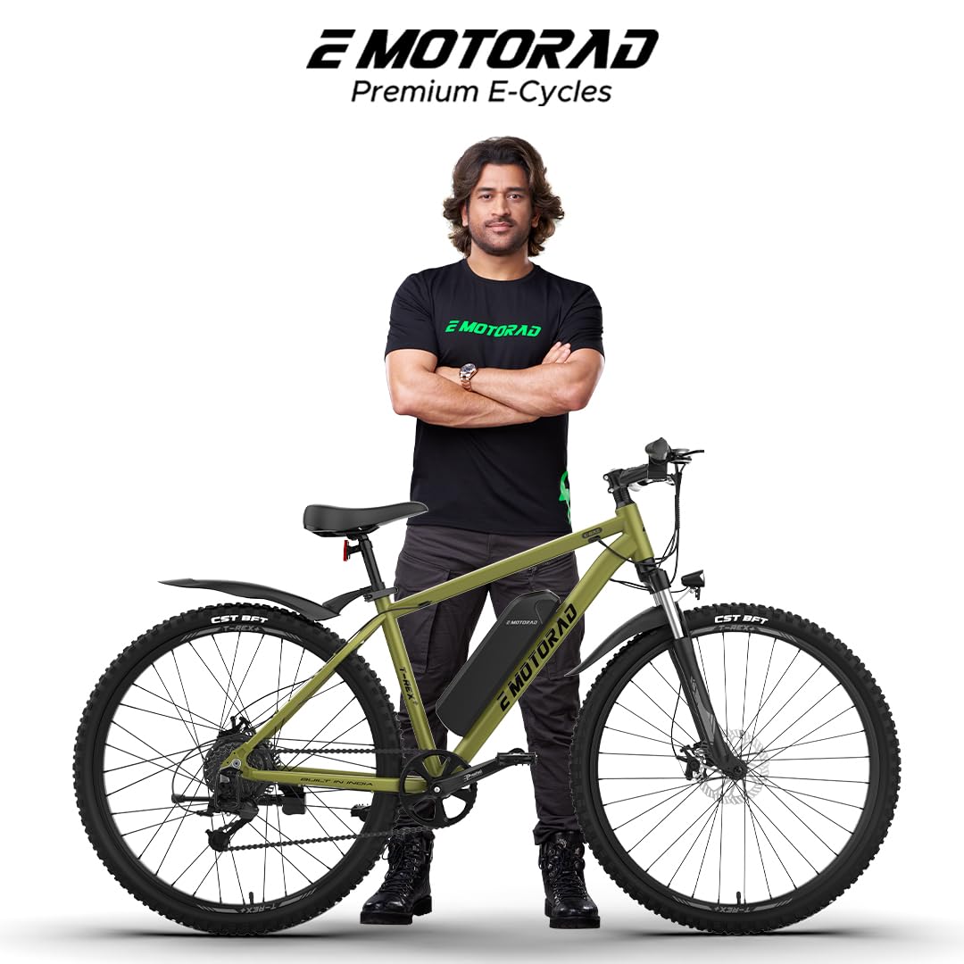 Man standing next to a green electric bike with 'E-Motorad' branding on a white background