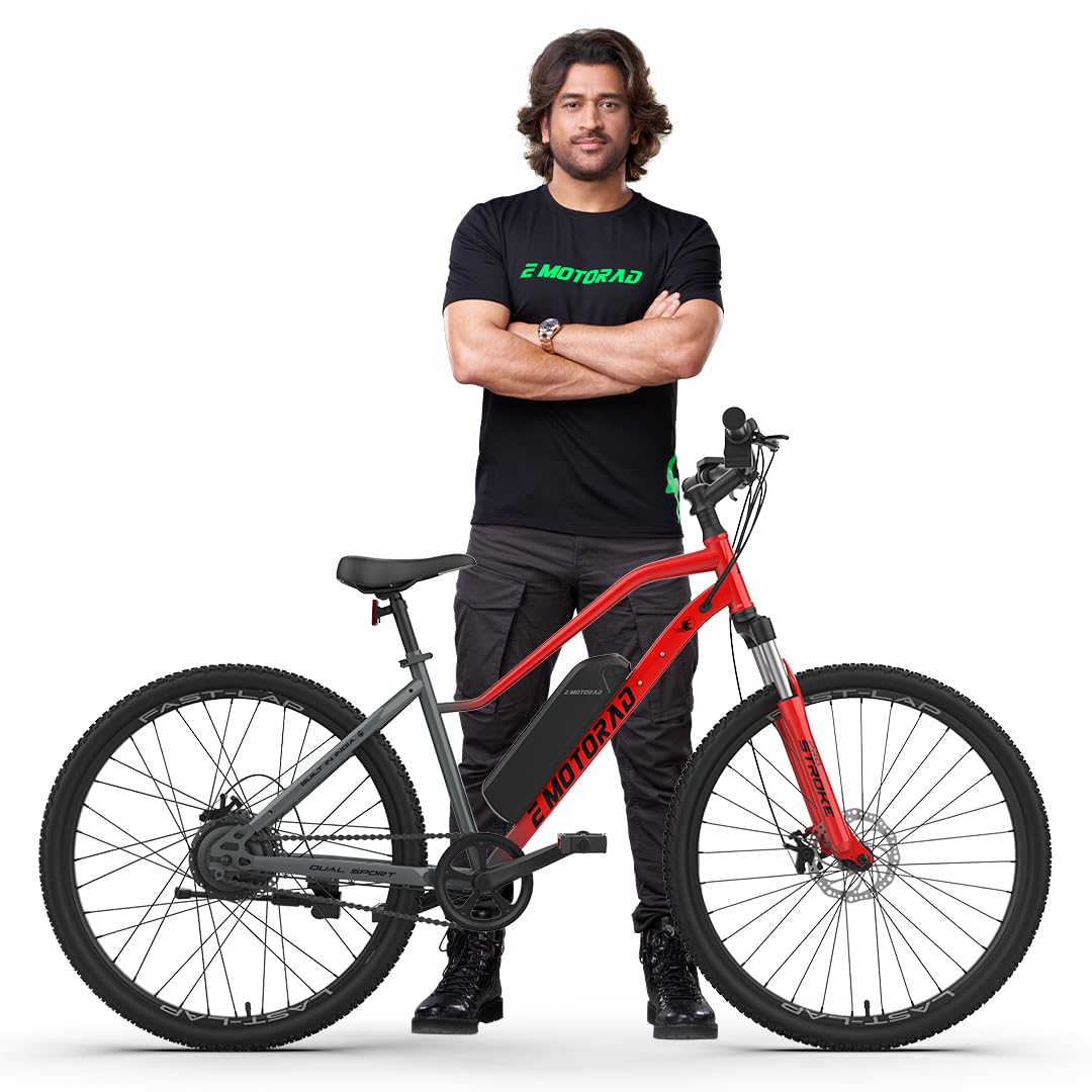 Man posing with EMotorad X2 electric cycle in Furious Red with 27.5-inch wheels

