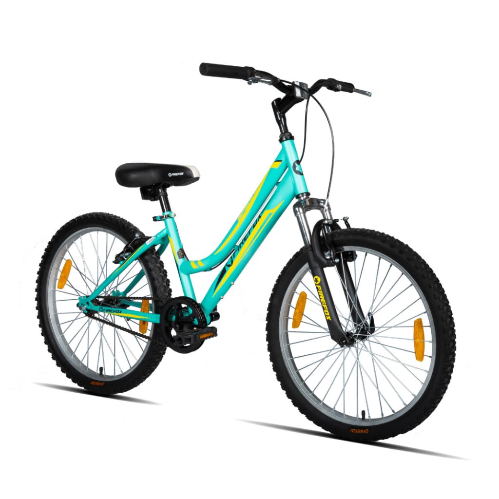 A green Firefox Breeze 24T hybrid bicycle designed for women, featuring a step-through frame, single-speed drivetrain, front suspension, and MTB tires with reflectors.
