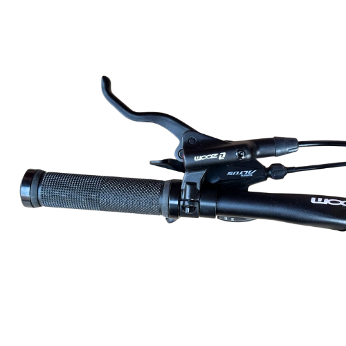 Handlebar grip with gear shifter and brake lever on Firefox Charger mountain bike