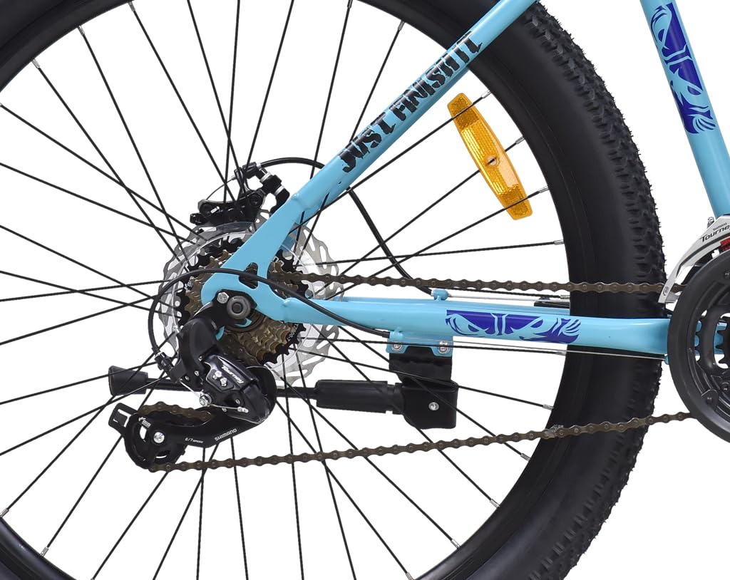 Close-up of rear derailleur, chain, and cassette on geared MTB cycle with disc brake and wide terrain tyre


