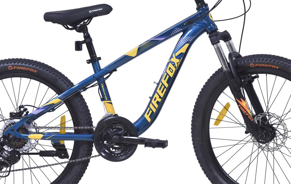 Side profile of Firefox Dominator 24D mountain bike showing frame design, dual disc brakes, suspension fork, and 21-speed drivetrain.
