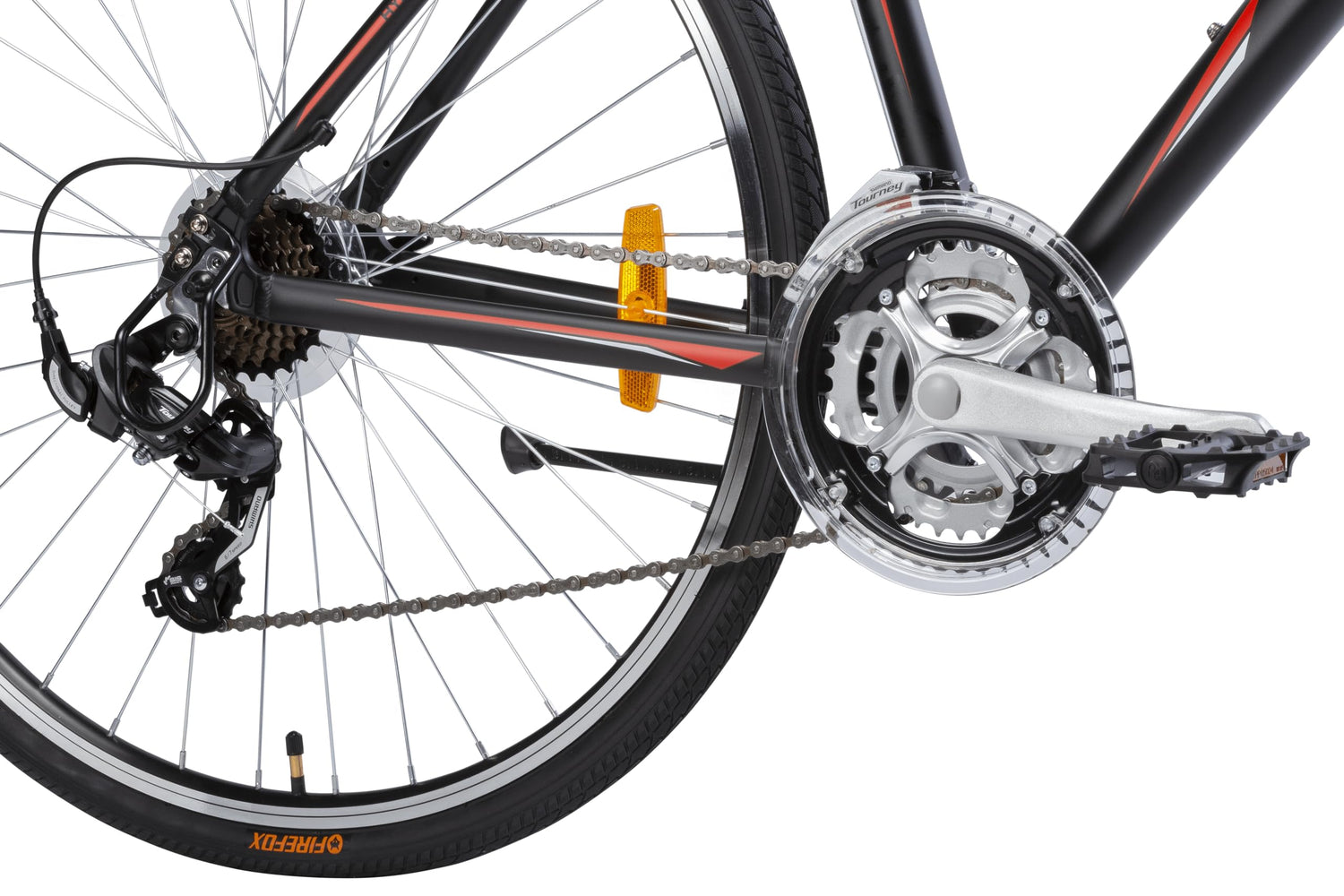 Close-up of Firefox hybrid bike drivetrain showing front crankset, rear derailleur, and gear system with reflector and Firefox branded tire.
