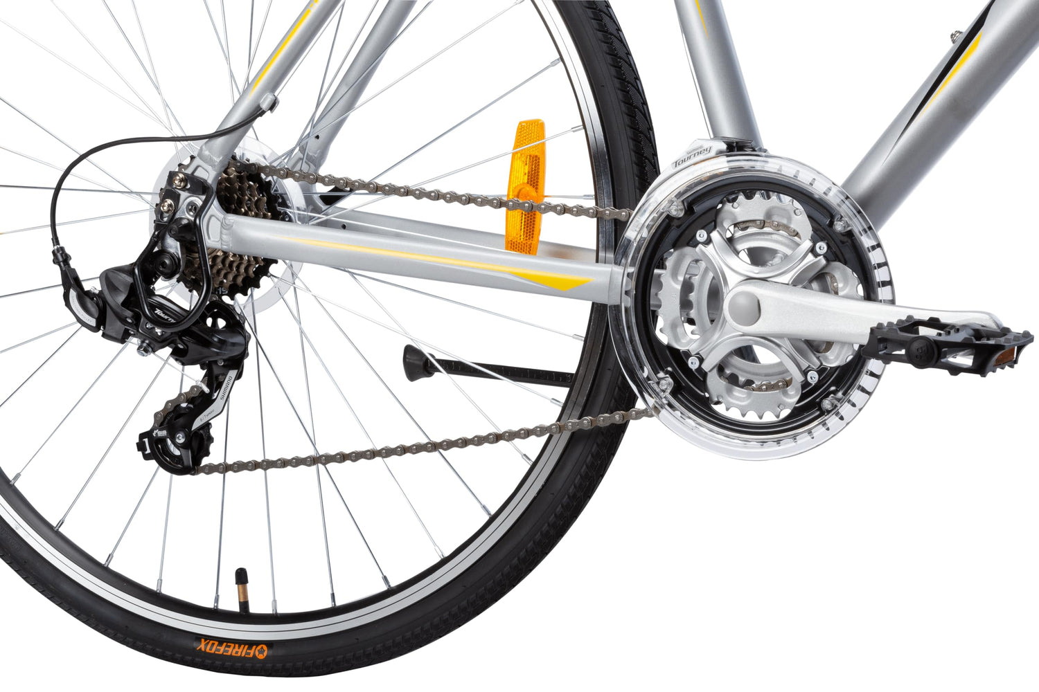 Close-up view of the FIREFOX Road Runner Pro V 700C hybrid cycle’s rear gear system and front crankset with chainring cover, featuring Shimano derailleur and alloy pedals.
