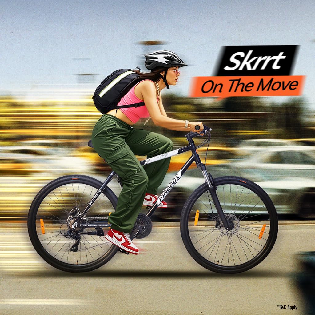 Firefox Rush+ 700C 21 Speed Hybrid Bicycle riding smoothly on city roads