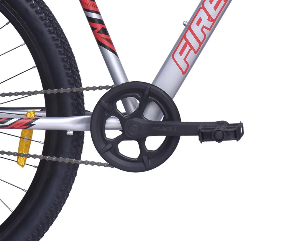 Close-up of crankset, pedal, and chain section of the FIREFOX Tremor X 29 D single speed mountain cycle in silver.
