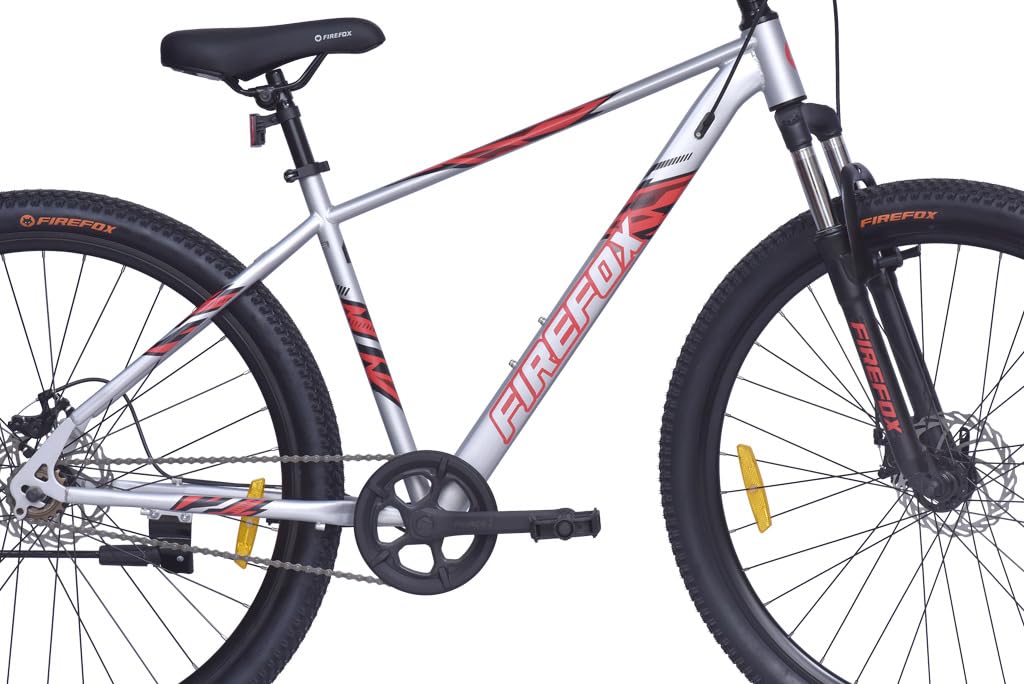 Full side profile of the FIREFOX Tremor X 29 D single speed mountain bicycle in silver with disc brakes and front suspension.
