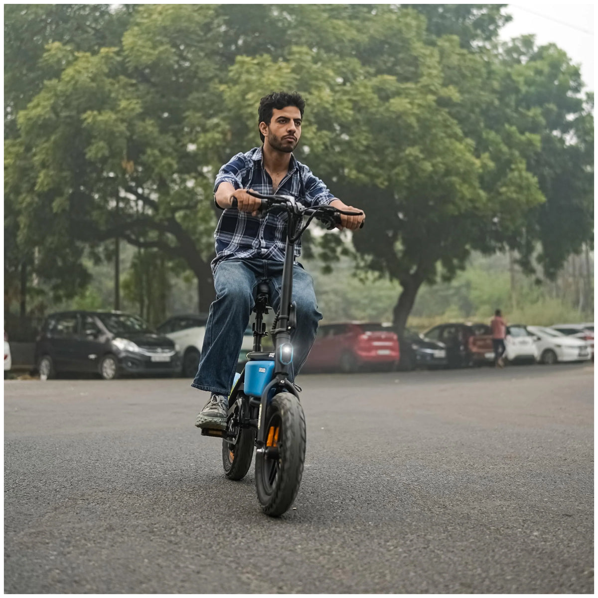 UBOARD Space Bike Pro blue electric cycle riding on road